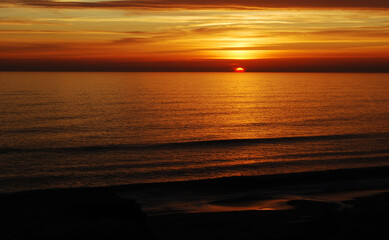 the sun sets in a spectacular evening color