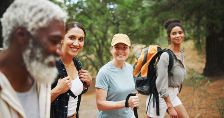 Fitness, smile and people in nature for hiking, explore environment or journey on trail. Trekking group, man guide and walking in forest for exercise, explain route or outdoor for wellness activity