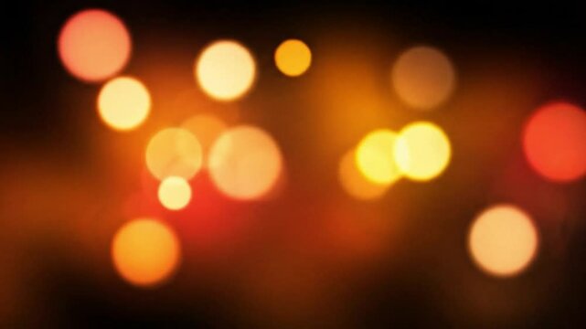 A captivating arrangement of luminous spherical lights in warm shades of yellow, orange, and red, creating a soft, magical glow and a beautiful bokeh effect, perfect for atmospheric and celebratory ba