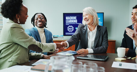 Business, people and shaking hands in presentation for success of machine learning contract, offer...