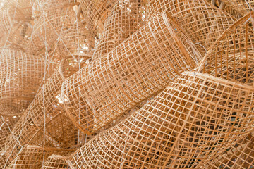 A collection of bamboo fish traps intricately arranged, showcasing traditional craftsmanship.