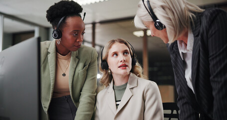 Fototapeta premium Call center, group and mentor coaching women for customer service or sales advice at night. Computer, contact us and telemarketing manager with discussion, helping interns and training in office