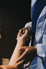 Orthopedist examining patient in hospital
