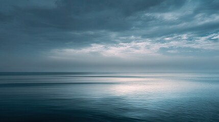 Obraz premium Tranquil Minimalist Seascape with Smooth Blue Cloudy Horizon