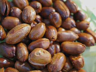 Roasted, shelled, dark brown peanuts