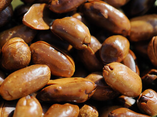 Roasted, shelled, dark brown peanuts