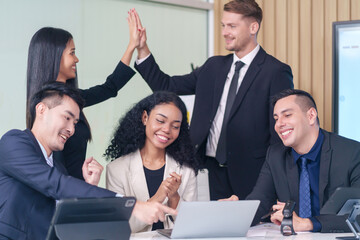 multiracial business people meeting at table in office room,doing gesture sign of success business,applause,hands high five,hands fist and smile happily