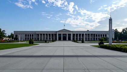 Fototapeta premium Modern Architectural Structure with Clear Sky and Green Landscape