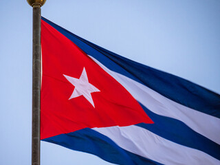 Cuba flag flaping in wind. Close-up of an Cuban flag flying in the wind against a background of clear sky.
