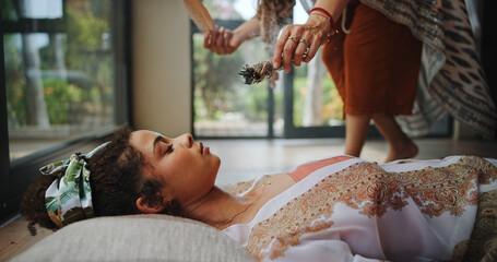 Spiritual, healing and woman with shaman, hands and smudging for cleansing, traditional and inner...