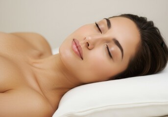 Obraz premium Woman resting peacefully on a pillow with eyes closed in a serene setting