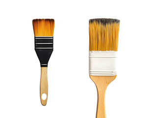 Close-up view of two paintbrushes, one black and one with gold bristles, differing in size