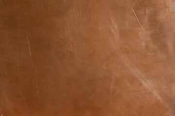 Copper backdrop. Empty copper background with brushed polished texture. Natural light in the upper right corner. Copy space.