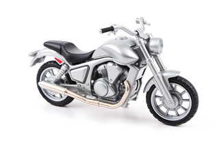 Silver toy motorcycle standing on white background