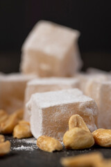 oriental sweets made from sugar and molasses with peanuts added, closeup, side view