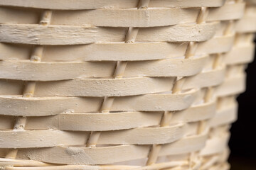 a white basket for food or other items, natural branches painted white from which a decorative...