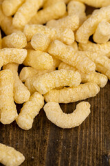 corn sticks made from corn flour, a large number of ready-made corn sticks for eating or making breakfast with milk. corn sticks on a wooden board