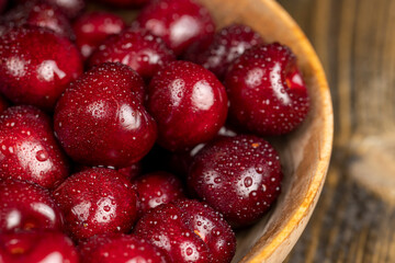 wet cherry fruits on the table, view from above