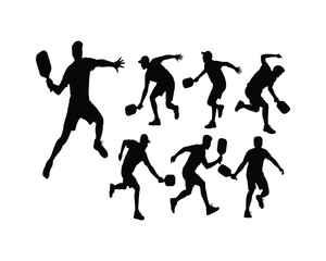 A black and white silhouette illustration of three male pickleball players in dynamic action poses against a white background. The silhouettes show players in various playing positions 