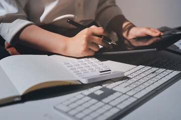 Obraz premium Expert woman asian female people review data number costing managerial account prepare monthly actual cost variance report at tax audit office. ESG sheet budget control ERP process service project.