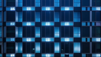 Symmetrical Urban Architecture with Blue Window Lights on Contemporary Building