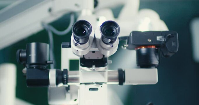 Dental microscope on the background of modern dentistry. Medical equipment. Dental operating microscope with rotary double binocular.