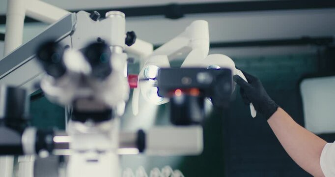 Dental binocular microscope in the dentist's office.  Optical instrument for diagnosis and treatment in surgery and dentistry.