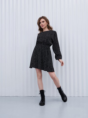 Girl model in stylish clothes posing in studio, fashion photo.