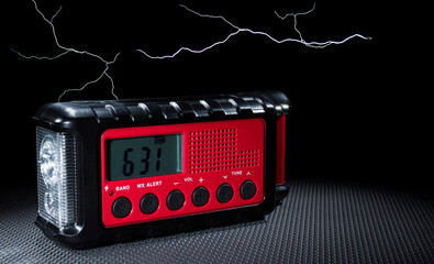 Weather radio with clock and emergency light and storm