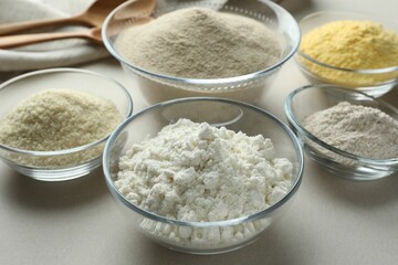 Different types of flour on white background, closeup