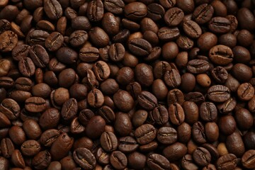Aromatic coffee beans as background, top view