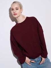 Fototapeta premium Girl model in stylish clothes posing in studio, fashion photo.