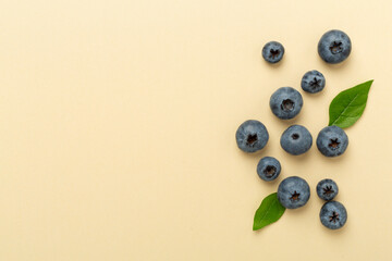 Fresh bright blueberries on color background,top view