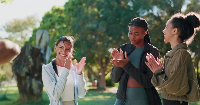 Man, women and hands stack for exercise at park with motivation, goals and phone for training in summer. Coach, people and support for workout, fitness and applause with success with celebration