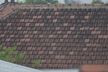 Detailed view of a weathered clay tile roof