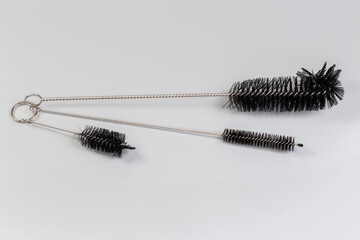 Сleaning brushes with soft plastic bristles on twisted wire core