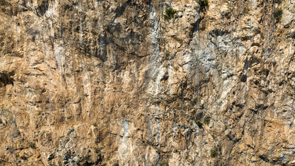 Closeup of a containment structure of a rock wall.
