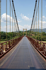 Fototapeta premium Vietnamese suspension bridge in lush nature