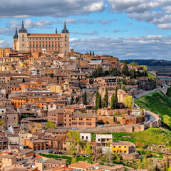 Naklejka premium Toledo with Alcazar castle at sunset, Castilla-La Mancha, Spain 