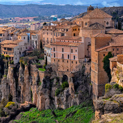 Naklejka premium Cuenca, Castile-La Mancha, Spain. Houses hanging on a cliff edge in the old town of Cuenca. Travel and Tourism in Europe 