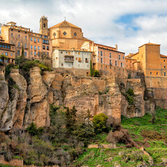 Fototapeta premium Cuenca, Castile-La Mancha, Spain. Houses hanging on a cliff edge in the old town of Cuenca. Travel and Tourism in Europe 