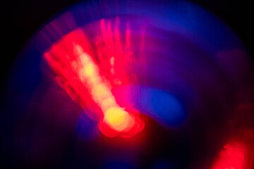 Red light leaks on dark background. Abstract background for design with random shapes. Colorful light streaks for special effects.