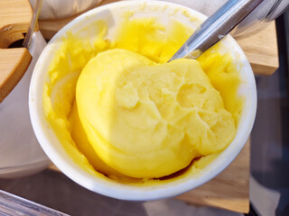 Butter in a cup with spoon 