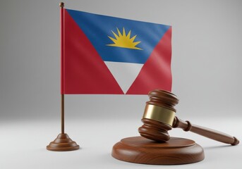 A wooden gavel with a gold band and the flag of antigua and barbuda in the background on a white surface