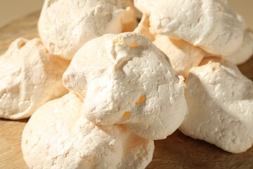 Delicious homemade meringue cookies on table, closeup