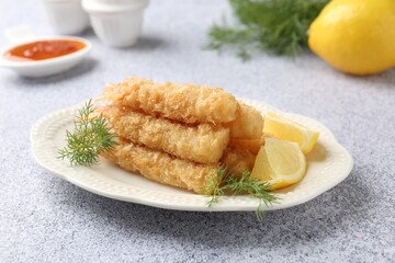 Tasty tempura shrimps, lemon and dill on grey textured table, closeup