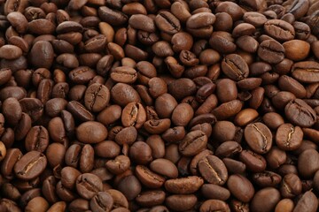 Roasted coffee beans as background, closeup view