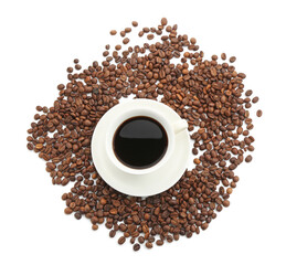 Aromatic coffee in cup and beans isolated on white, top view