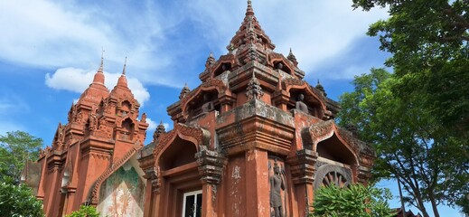 Wat Khao Angkhan 7 May 2025 The architecture of Wat Khao Angkhan with blue sky with clouds is located in Chaloem Phra Kiat District, Buriram Province, Thailand.