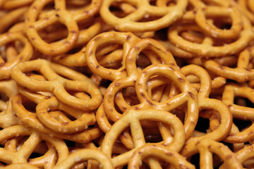 Inviting Macro View Of Golden Brown Salty Pretzel Twists Piled Together. Detailed Baked Texture And...